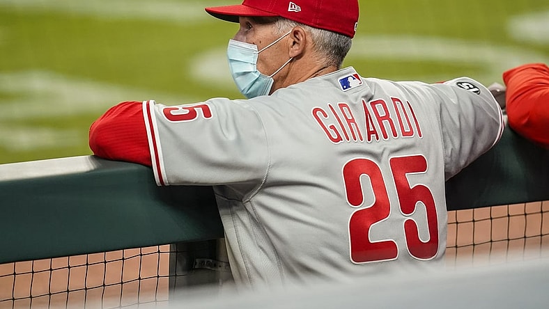 Apr 9, 2021; Cumberland, Georgia, USA; Philadelphia Phillies manager Joe Girardi (25) shown in the dugout against the Atlanta Braves during the seventh inning at Truist Park. Mandatory Credit: Dale Zanine-USA TODAY Sports