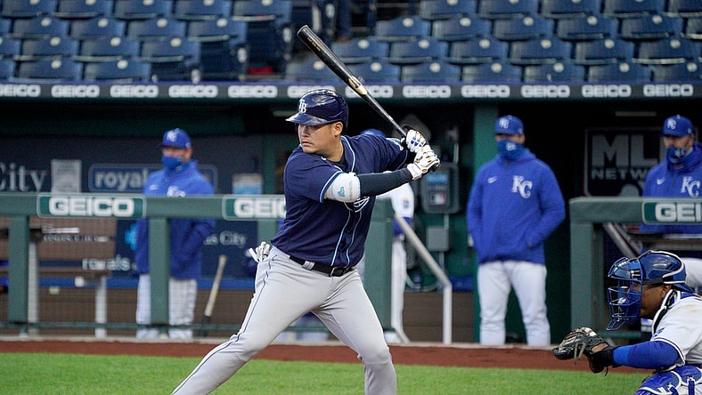 Apr 20, 2021; Kansas City, Missouri, USA; Tampa Bay Rays first baseman Yoshi Tsutsugo (25) at bat in the first inning against the Kansas City Royals at Kauffman Stadium. Mandatory Credit: Denny Medley-USA TODAY Sports