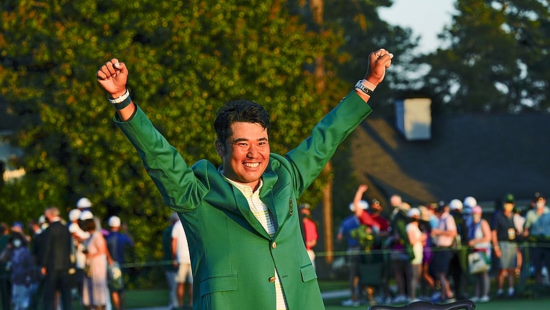 Apr 11, 2021; Augusta, Georgia, USA; Hideki Matsuyama celebrates his victory following the final round of The Masters golf tournament in his green jacket. Mandatory Credit: Michael Madrid-USA TODAY Sports