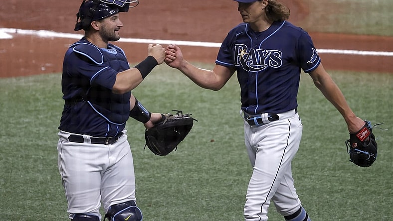 Apr 28, 2021; St. Petersburg, Florida, USA;  Tampa Bay Rays starting pitcher Tyler Glasnow (20) is congratulated by  catcher Mike Zunino (10) at the end of the second inning against the Oakland Athletics at Tropicana Field. Mandatory Credit: Kim Klement-USA TODAY Sports