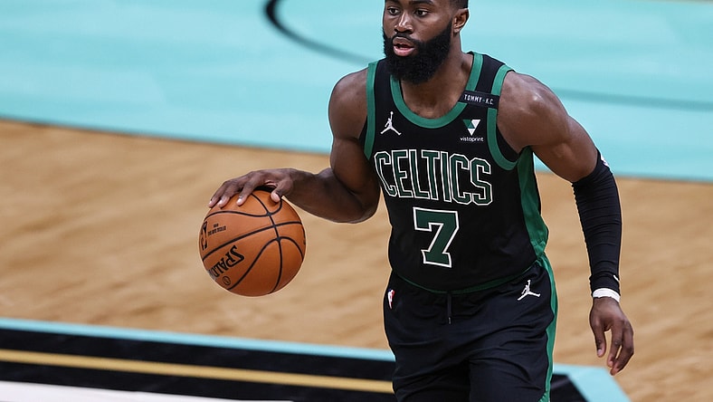 Apr 25, 2021; Charlotte, North Carolina, USA; Boston Celtics guard Jaylen Brown (7) brings the ball up court against the Charlotte Hornets in the second half at Spectrum Center. The Charlotte Hornets won 125-104. Mandatory Credit: Nell Redmond-USA TODAY Sports