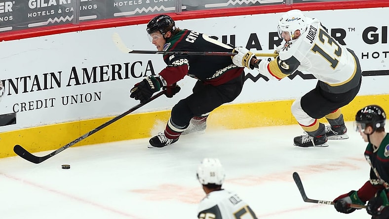 Apr 30, 2021; Glendale, Arizona, USA; Arizona Coyotes defenseman Jakob Chychrun (6) skates with the puck against Vegas Golden Knights right winger Tomas Jurco (13) in the first period at Gila River Arena. Mandatory Credit: Billy Hardiman-USA TODAY Sports