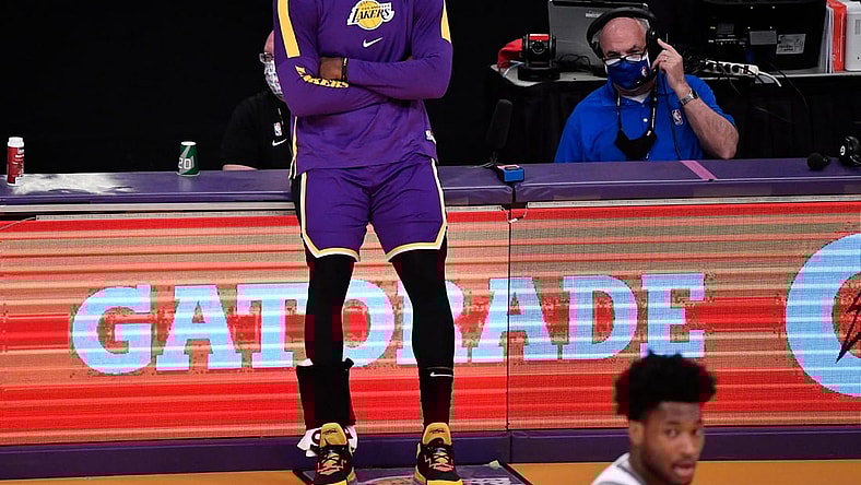Apr 30, 2021; Los Angeles, California, USA; Los Angeles Lakers forward LeBron James (23) waits to reenter the game during there second quarter against the Sacramento Kings at Staples Center. James returned to the Lakers lineup after recovering from an ankle injury. Mandatory Credit: Robert Hanashiro-USA TODAY Sports