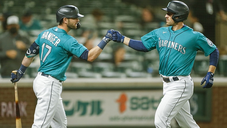 Apr 30, 2021; Seattle, Washington, USA; Seattle Mariners designated hitter Tom Murphy (2) bumps fists with right fielder Mitch Haniger (17) after digging a solo-home run against the Los Angeles Angels during the fourth inning at T-Mobile Park. Mandatory Credit: Joe Nicholson-USA TODAY Sports