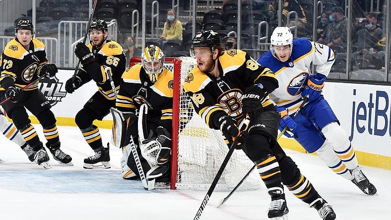 May 1, 2021; Boston, Massachusetts, USA; Boston Bruins right wing David Pastrnak (88) skates with the puck while Buffalo Sabres right wing Tage Thompson (72) gives chase during the first period at TD Garden. Mandatory Credit: Bob DeChiara-USA TODAY Sports