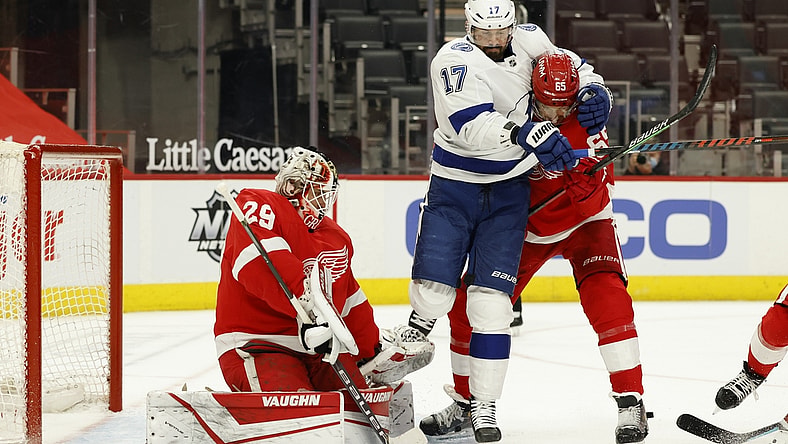 May 1, 2021; Detroit, Michigan, USA;  Tampa Bay Lightning left wing Alex Killorn (17) and Detroit Red Wings defenseman Danny DeKeyser (65) fight for position with in front of Detroit Red Wings goaltender Thomas Greiss (29) in the first period at Little Caesars Arena. Mandatory Credit: Rick Osentoski-USA TODAY Sports