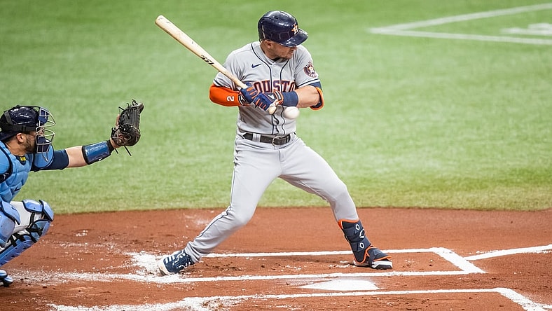 May 1, 2021; St. Petersburg, Florida, USA; Houston Astros third baseman Alex Bregman (2) shrugs to avoid a pitch during the first inning of a game against the Tampa Bay Rays at Tropicana Field. Mandatory Credit: Mary Holt-USA TODAY Sports