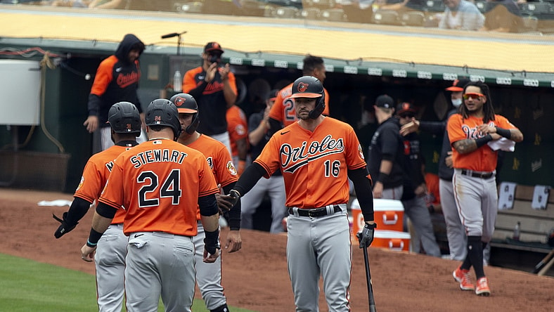 May 1, 2021; Oakland, California, USA; Baltimore Orioles players celebrate a three-RBI single and two Oakland Athletics throwing errors during the third inning at RingCentral Coliseum. Mandatory Credit: D. Ross Cameron-USA TODAY Sports