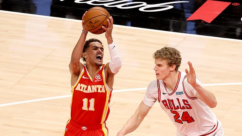 May 1, 2021; Atlanta, Georgia, USA; Atlanta Hawks guard Trae Young (11) attempts a shot against Chicago Bulls forward Lauri Markkanen (24) during the first quarter at State Farm Arena. Mandatory Credit: Jason Getz-USA TODAY Sports