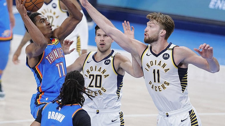 May 1, 2021; Oklahoma City, Oklahoma, USA; Oklahoma City Thunder guard Theo Maledon (11) shoots as Indiana Pacers forward Domantas Sabonis (11) defends the shot during the second quarter at Chesapeake Energy Arena. Mandatory Credit: Alonzo Adams-USA TODAY Sports
