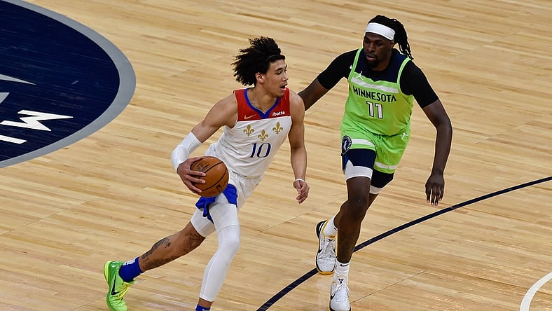 May 1, 2021; Minneapolis, Minnesota, USA; New Orleans Pelicans center Jaxson Hayes (10) controls the ball as Minnesota Timberwolves center Naz Reid (11) defends during the first quarter at Target Center. Mandatory Credit: Jeffrey Becker-USA TODAY Sports
