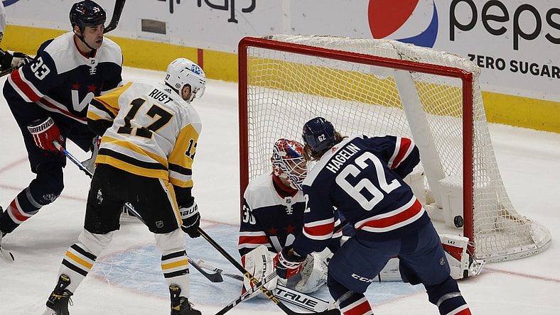 May 1, 2021; Washington, District of Columbia, USA; Pittsburgh Penguins right wing Bryan Rust (17) shoots the puck on Washington Capitals goaltender Ilya Samsonov (30) as Capitals left wing Carl Hagelin (62) defends in the third period at Capital One Arena. Mandatory Credit: Geoff Burke-USA TODAY Sports