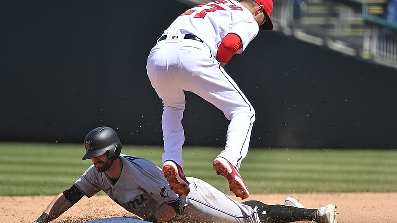 May 2, 2021; Washington, District of Columbia, USA; Miami Marlins third baseman Jon Berti (5) steals second base under the tag by Washington Nationals second baseman Jordy Mercer (27) at Nationals Park. Mandatory Credit: Brad Mills-USA TODAY Sports