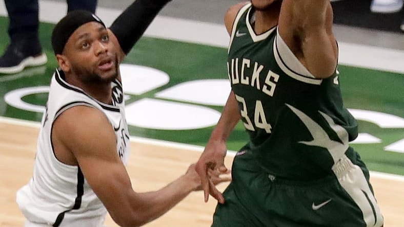 Bucks forward Giannis Antetokounmpo throws down a dunk against Nets forward Bruce Brown during the second quarter.

Mjs Bucks 07513