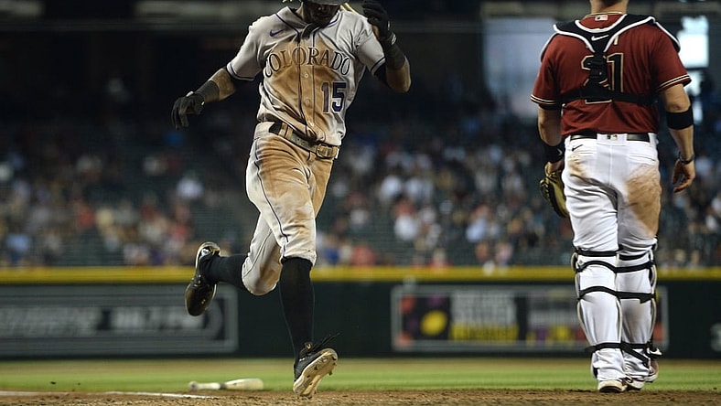 May 2, 2021; Phoenix, Arizona, USA; Colorado Rockies left fielder Raimel Tapia (15) scores a run against the Arizona Diamondbacks during the eighth inning at Chase Field. Mandatory Credit: Joe Camporeale-USA TODAY Sports