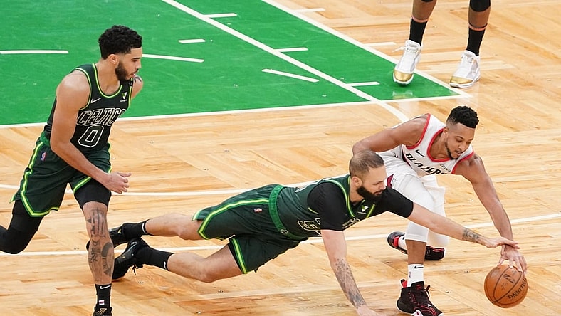May 2, 2021; Boston, Massachusetts, USA; Boston Celtics guard Evan Fournier (94) steals the ball from Portland Trail Blazers guard CJ McCollum (3) in the fourth quarter at TD Garden. Mandatory Credit: David Butler II-USA TODAY Sports