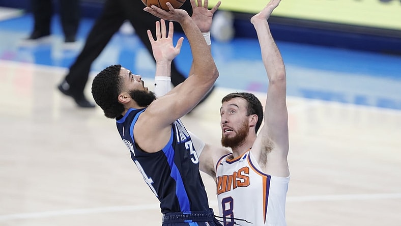 May 2, 2021; Oklahoma City, Oklahoma, USA; Oklahoma City Thunder forward Kenrich Williams (34) shoots as Phoenix Suns forward Frank Kaminsky (8) defends the shot during the third quarter at Chesapeake Energy Arena. Mandatory Credit: Alonzo Adams-USA TODAY Sports