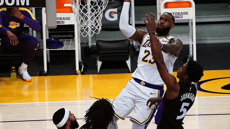 May 2, 2021; Los Angeles, California, USA; Los Angeles Lakers forward LeBron James (23) shoots against Toronto Raptors forward Stanley Johnson (5) during the first half at Staples Center. Mandatory Credit: Gary A. Vasquez-USA TODAY Sports