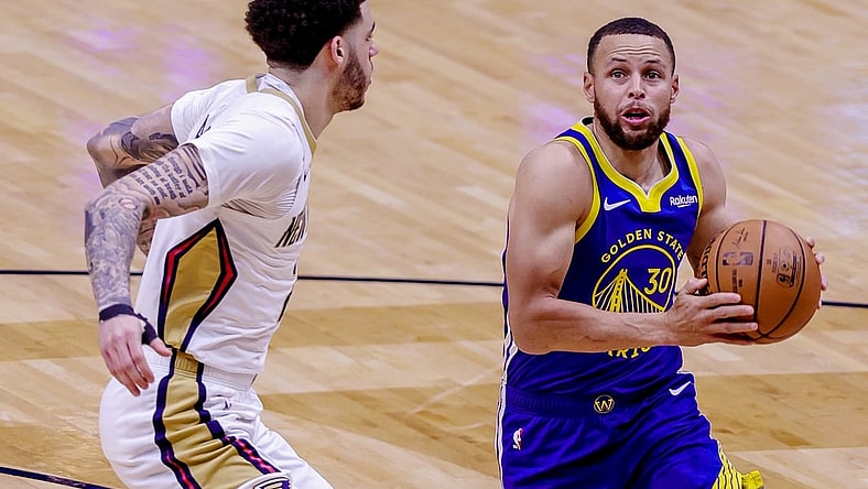 May 3, 2021; New Orleans, Louisiana, USA; Golden State Warriors guard Stephen Curry (30) drives to the basket against New Orleans Pelicans guard Lonzo Ball (2) during the first half at the Smoothie King Center. Mandatory Credit: Stephen Lew-USA TODAY Sports
