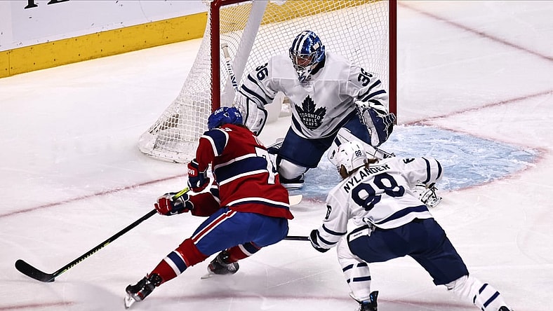 May 3, 2021; Montreal, Quebec, CAN; Montreal Canadiens right wing Tyler Toffoli (73) shoots the puck against Toronto Maple Leafs goaltender Jack Campbell (36) as center William Nylander (88) defends during the first period at Bell Centre. Mandatory Credit: Jean-Yves Ahern-USA TODAY Sports
