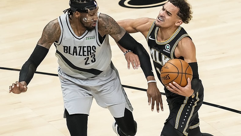 May 3, 2021; Atlanta, Georgia, USA; Portland Trail Blazers forward Robert Covington (23) is called for a foul while defending Atlanta Hawks guard Trae Young (11) during the first quarter at State Farm Arena. Mandatory Credit: Dale Zanine-USA TODAY Sports