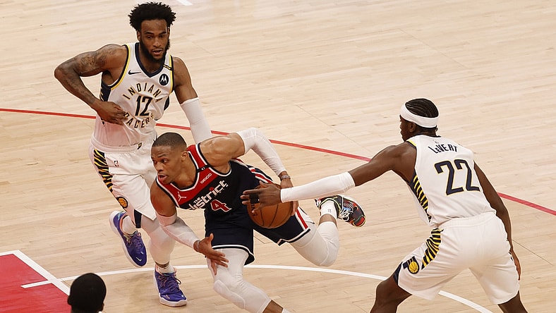 May 3, 2021; Washington, District of Columbia, USA; Washington Wizards guard Russell Westbrook (4) drives to the basket past Indiana Pacers guard Caris LeVert (22) in the second quarter at Capital One Arena. Mandatory Credit: Geoff Burke-USA TODAY Sports