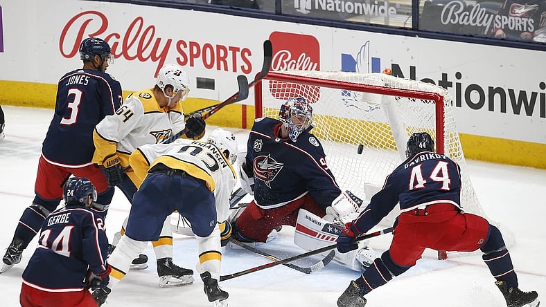May 3, 2021; Columbus, Ohio, USA; Columbus Blue Jackets goalie Elvis Merzlikins (90) looks back as the shot from Nashville Predators center Ryan Johansen (92) goes in to the goal during the second period at Nationwide Arena. Mandatory Credit: Russell LaBounty-USA TODAY Sports