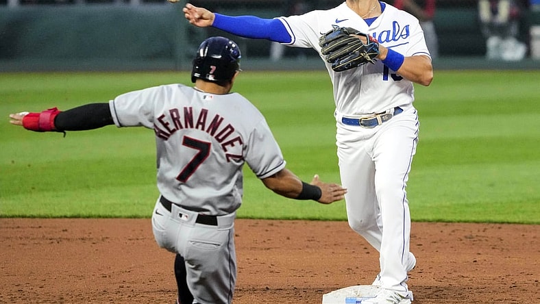 May 3, 2021; Kansas City, Missouri, USA; Kansas City Royals second baseman Whit Merrifield (15) throws to first base after forcing out Cleveland Indians second baseman Cesar Hernandez (7) during the third inning at Kauffman Stadium. Mandatory Credit: Jay Biggerstaff-USA TODAY Sports