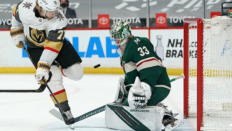 May 3, 2021; Saint Paul, Minnesota, USA; Vegas Golden Knights center William Karlsson (71) is stopped by Minnesota Wild goaltender Cam Talbot (33) during the first period at Xcel Energy Center. Mandatory Credit: Nick Wosika-USA TODAY Sports