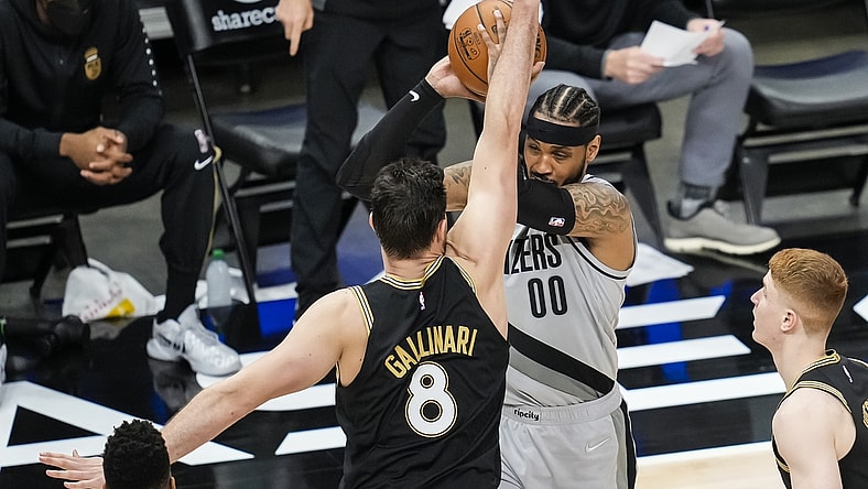 May 3, 2021; Atlanta, Georgia, USA; Portland Trail Blazers forward Carmelo Anthony (00) is defended by Atlanta Hawks forward Danilo Gallinari (8) during the second half at State Farm Arena. Mandatory Credit: Dale Zanine-USA TODAY Sports