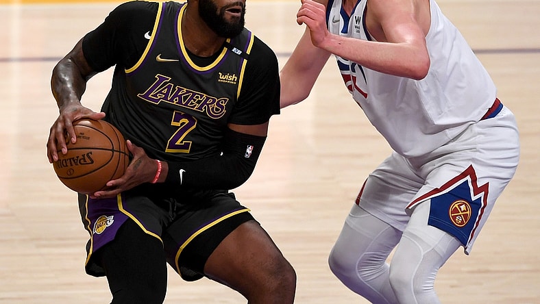 May 3, 2021; Los Angeles, California, USA; Los Angeles Lakers center Andre Drummond (2) is defended by Denver Nuggets center Nikola Jokic (15) in the first quarter of the game at Staples Center. Mandatory Credit: Jayne Kamin-Oncea-USA TODAY Sports