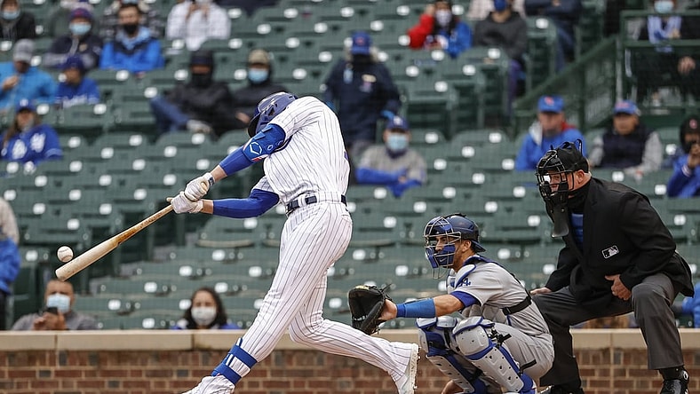 May 4, 2021; Chicago, Illinois, USA; Chicago Cubs third baseman Kris Bryant (17) doubles against the Los Angeles Dodgers during the first inning of the first game of a doubleheader at Wrigley Field. Mandatory Credit: Kamil Krzaczynski-USA TODAY Sports