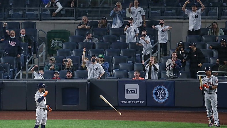 May 4, 2021; Bronx, New York, USA; Yankees fans react as Houston Astros second baseman Jose Altuve (27) tosses his bat away after striking out to end the top of the third inning against the New York Yankees at Yankee Stadium. Mandatory Credit: Brad Penner-USA TODAY Sports