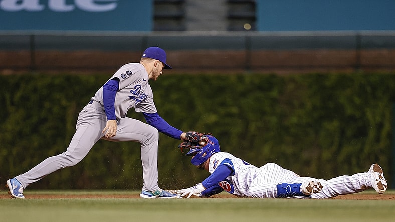 May 4, 2021; Chicago, Illinois, USA; Chicago Cubs third baseman Kris Bryant (17) is safe at second base after hitting a double as Los Angeles Dodgers second baseman Gavin Lux (9) applies a late tag during the third inning of the second game of a doubleheader at Wrigley Field. Mandatory Credit: Kamil Krzaczynski-USA TODAY Sports