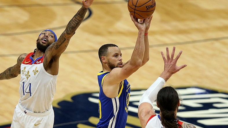 May 4, 2021; New Orleans, Louisiana, USA; Golden State Warriors guard Stephen Curry (30) shoots while defended by  New Orleans Pelicans forward Brandon Ingram (14) and center Steven Adams (12) in the second quarter at the Smoothie King Center. Mandatory Credit: Chuck Cook-USA TODAY Sports