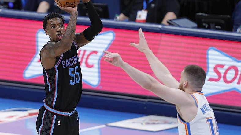 May 4, 2021; Oklahoma City, Oklahoma, USA; Sacramento Kings guard Delon Wright (55) shoots as Oklahoma City Thunder guard Svi Mykhailiuk (14) defends during the third quarter at Chesapeake Energy Arena. Mandatory Credit: Alonzo Adams-USA TODAY Sports