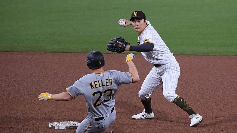 May 4, 2021; San Diego, California, USA; San Diego Padres shortstop Ha-seong Kim (R) throws to first base after forcing out Pittsburgh Pirates starting pitcher Mitch Keller (23) at second base during the fifth inning at Petco Park. Mandatory Credit: Orlando Ramirez-USA TODAY Sports