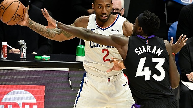 May 4, 2021; Los Angeles, California, USA; LA Clippers forward Kawhi Leonard (2) is defendedd by Toronto Raptors forward Pascal Siakam (43) during the third quarter at Staples Center. Mandatory Credit: Robert Hanashiro-USA TODAY Sports