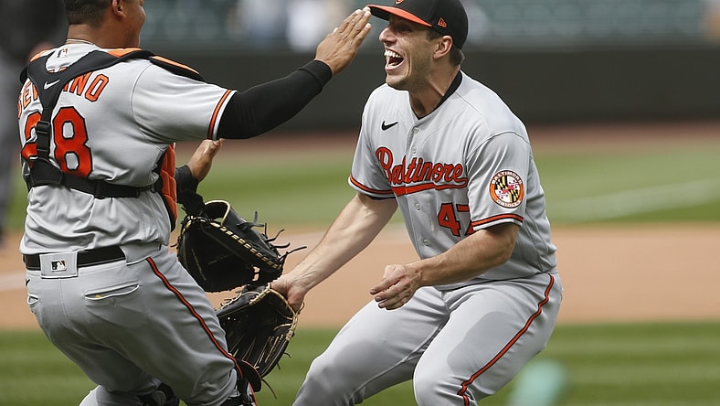 May 5, 2021; Seattle, Washington, USA; Baltimore Orioles starting pitcher John Means (47) and catcher Pedro Severino (28) celebrate following the final out of a no-hit 6-0 victory against the Seattle Mariners at T-Mobile Park. Mandatory Credit: Joe Nicholson-USA TODAY Sports