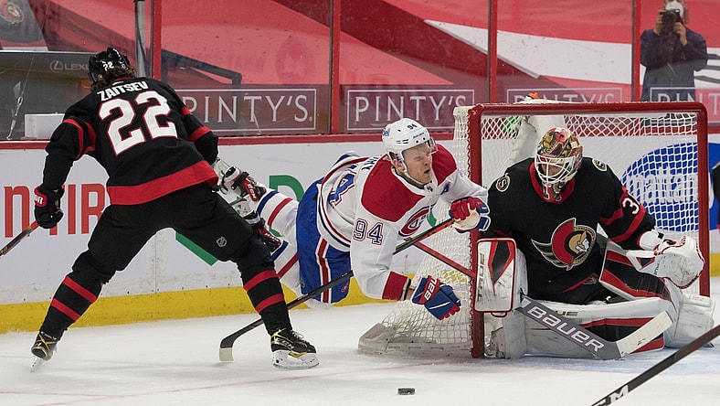 May 5, 2021; Ottawa, Ontario, CAN; Montreal Canadiens right wing Corey Perry (94) falls and loses control of the puck in front of Ottawa Senators goalie Anton Forsberg (31) in the first period at the Canadian Tire Centre. Mandatory Credit: Marc DesRosiers-USA TODAY Sports