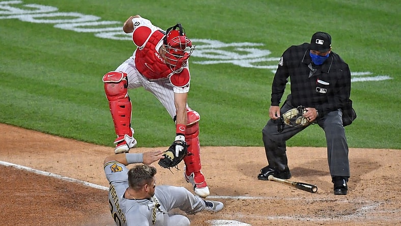 May 5, 2021; Philadelphia, Pennsylvania, USA; Philadelphia Phillies catcher J.T. Realmuto (10) tags out Milwaukee Brewers first baseman Daniel Vogelbach (20) at home during the third inning at Citizens Bank Park. Mandatory Credit: Eric Hartline-USA TODAY Sports