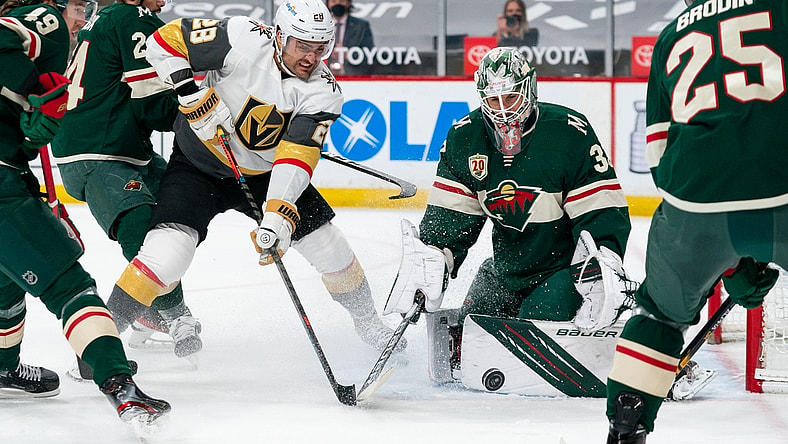 May 5, 2021; Saint Paul, Minnesota, USA; Vegas Golden Knights forward William Carrier (28) shoots against Minnesota Wild goalie Cam Talbot (33) in the first period at Xcel Energy Center. Mandatory Credit: Brad Rempel-USA TODAY Sports