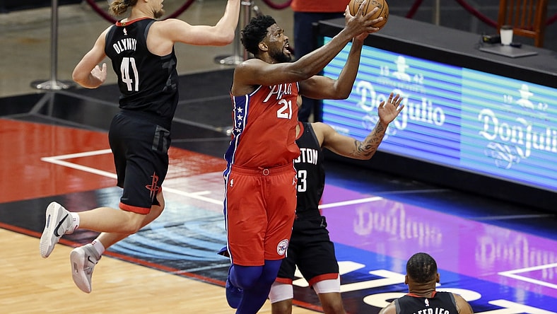May 5, 2021; Houston, Texas, USA;  Philadelphia 76ers center Joel Embiid (21) gets a shot up past Houston Rockets forward Kelly Olynyk (41) and guard Kevin Porter Jr., right, during the second half at Toyota Center. Mandatory Credit:  Michael Wyke/POOL PHOTOS-USA TODAY Sports