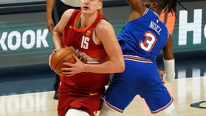 May 5, 2021; Denver, Colorado, USA;Denver Nuggets center Nikola Jokic (15) drives around New York Knicks center Nerlens Noel (3) in the second quarter at Ball Arena. Mandatory Credit: Ron Chenoy-USA TODAY Sports
