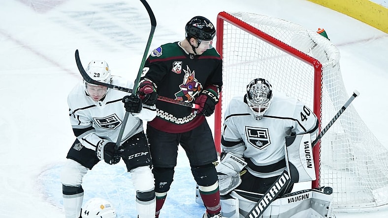 May 5, 2021; Glendale, Arizona, USA; Los Angeles Kings goaltender Calvin Petersen (40) makes a save as Arizona Coyotes center Lane Pederson and center Jaret Anderson-Dolan (28) battle for position during the first period at Gila River Arena. Mandatory Credit: Matt Kartozian-USA TODAY Sports