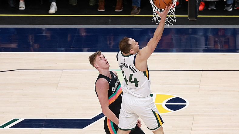 May 5, 2021; Salt Lake City, Utah, USA;  Utah Jazz forward Bojan Bogdanovic (44) gets past San Antonio Spurs forward Luka Samanic (19) and to the basket during the third quarter at Vivint Arena. Utah Jazz won 126-94. Mandatory Credit: Chris Nicoll-USA TODAY Sports