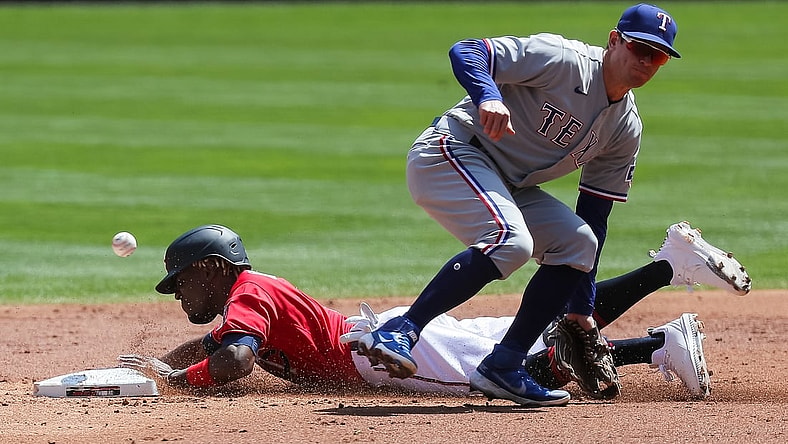May 6, 2021; Minneapolis, Minnesota, USA; Minnesota Twins shortstop Nick Gordon (1) steals second against the Texas Rangers second baseman Nick Solak (15) in the second inning at Target Field. Mandatory Credit: Brad Rempel-USA TODAY Sports
