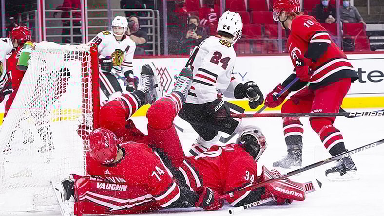 May 6, 2021; Raleigh, North Carolina, USA;  Carolina Hurricanes defenseman Jaccob Slavin (74) collides with goaltender Petr Mrazek (34) during the first period at PNC Arena. Mandatory Credit: James Guillory-USA TODAY Sports