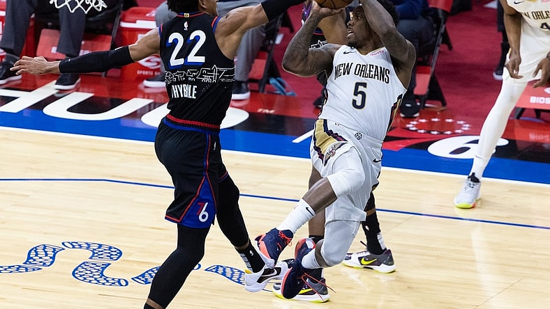 May 7, 2021; Philadelphia, Pennsylvania, USA; New Orleans Pelicans guard Eric Bledsoe (5) attempts to pass the ball pasts Philadelphia 76ers guard Matisse Thybulle (22) during the second quarter at Wells Fargo Center. Mandatory Credit: Bill Streicher-USA TODAY Sports