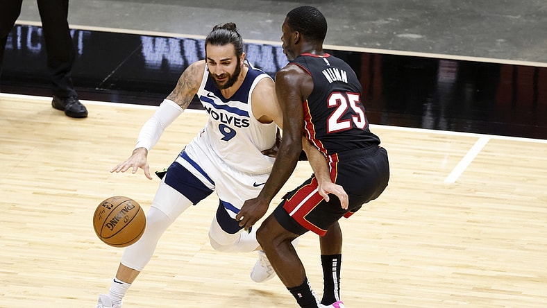 May 7, 2021; Miami, Florida, USA; Minnesota Timberwolves guard Ricky Rubio (9) dribbles the ball while defended by Miami Heat guard Kendrick Nunn (25) during the first half at American Airlines Arena. Mandatory Credit: Rhona Wise-USA TODAY Sports